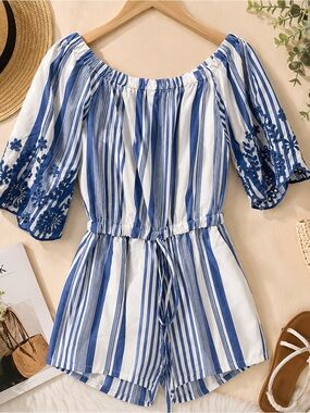 Beautiful Romper/details on sleeves.Can be worn off the shoulder.Slightly used.